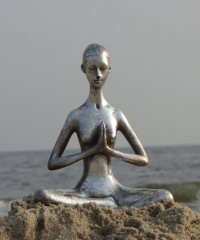 figure-meditating-beach